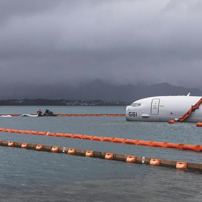 US Navy removes fuel from plane that overshot Hawaii runway and is now resting on a reef and sand